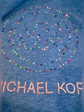 Handmade crystal MK Design on Blue V-Neck Tee Shirt. Great Ruffle puff sleeves.
